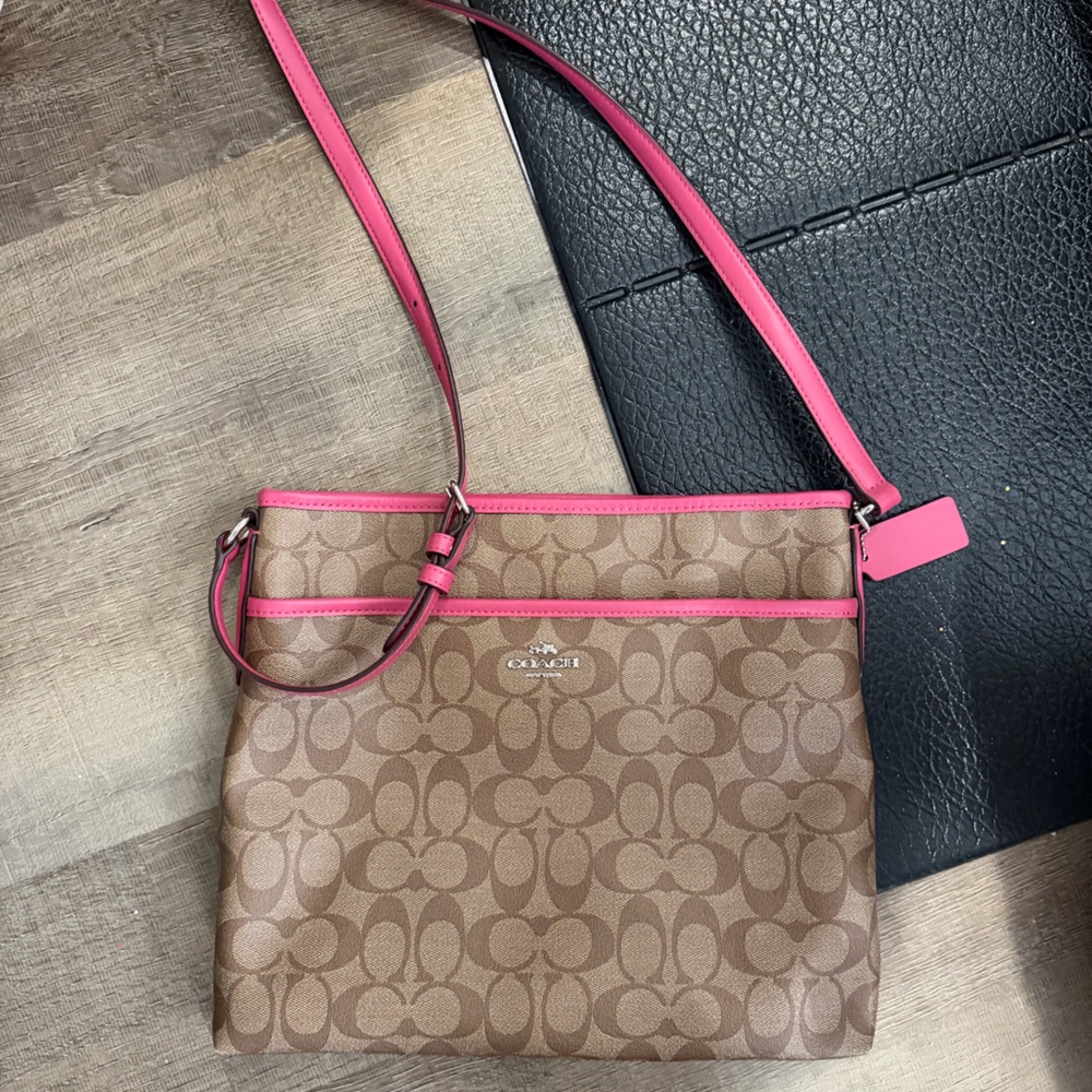 Coach Signature File Crossbody Bag monogram pattern with pink leather trim